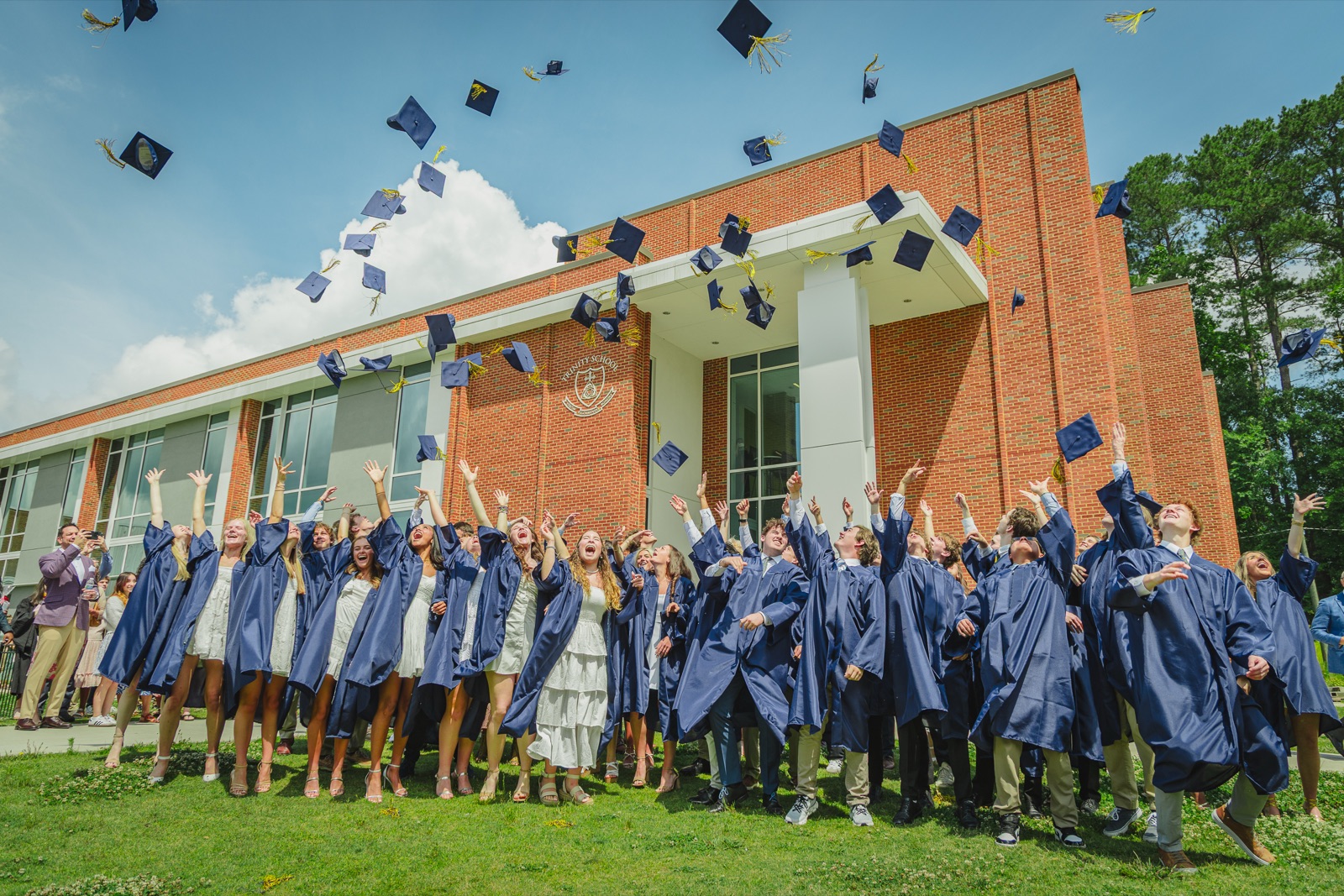 Graduates tossing caps